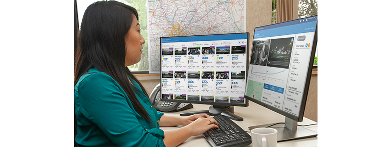 Woman at computer monitor reviewing video