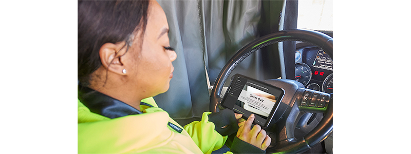 Woman on tablet completing training