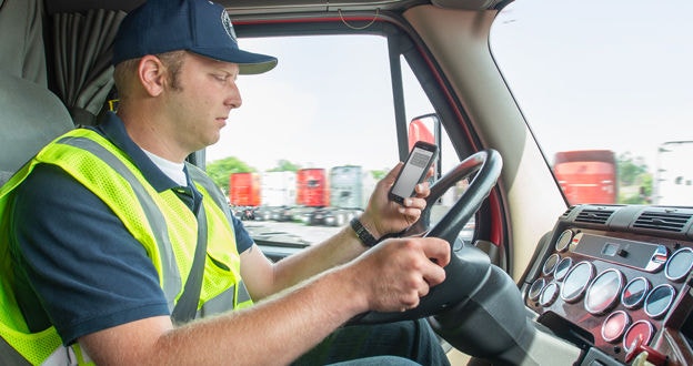 Distracted Driver looking at cellphone white driving