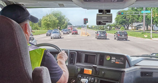 driver in truck, dash cam at intersection