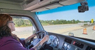 Driver with dual-facing dash cam